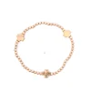 Fashion ENewton Design Signature Cross Gold Pattern 3 mm Bead Bracelet - Gold